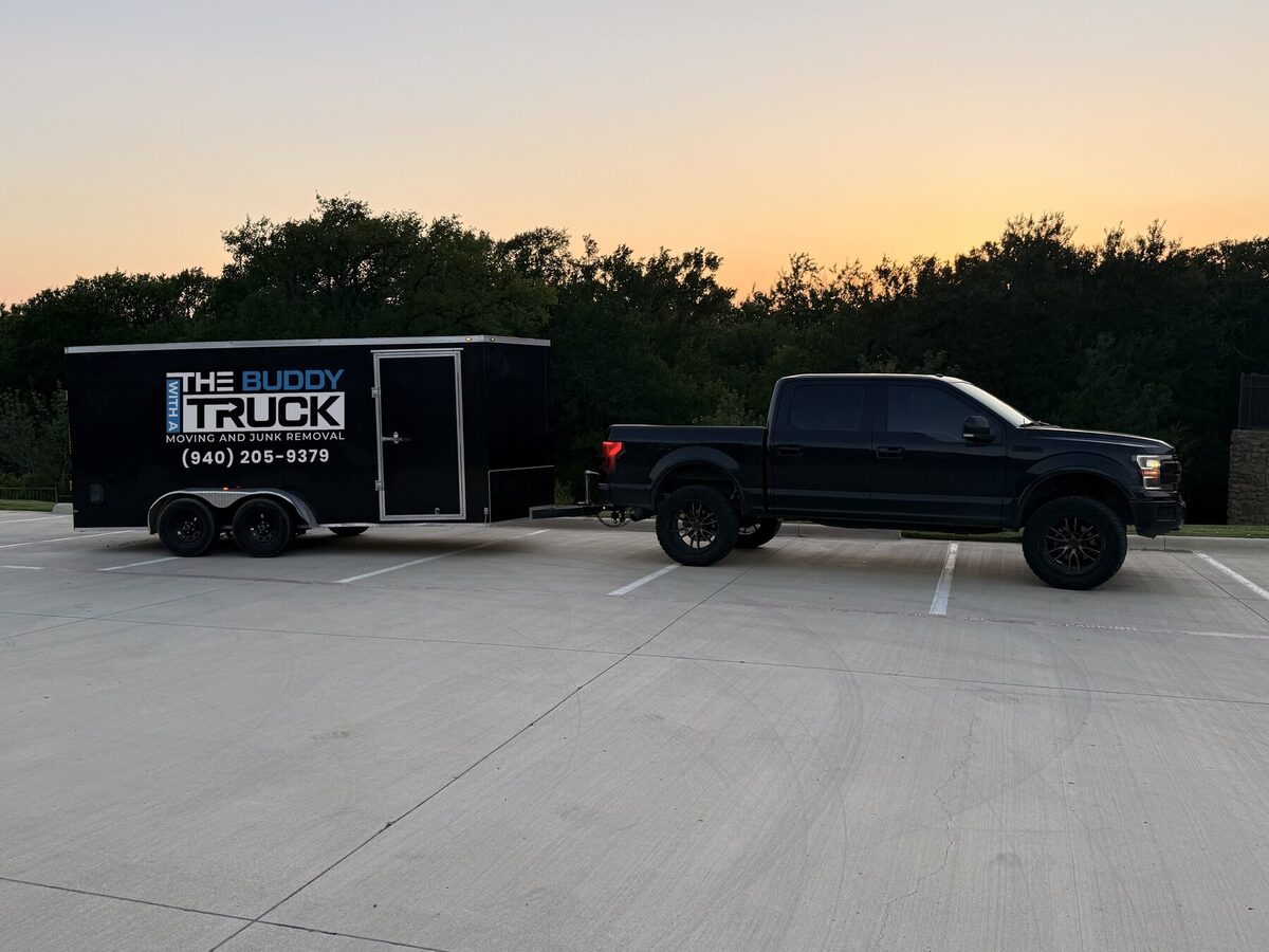 The Buddy With A Truck pickup and enclosed cargo trailer at sunset